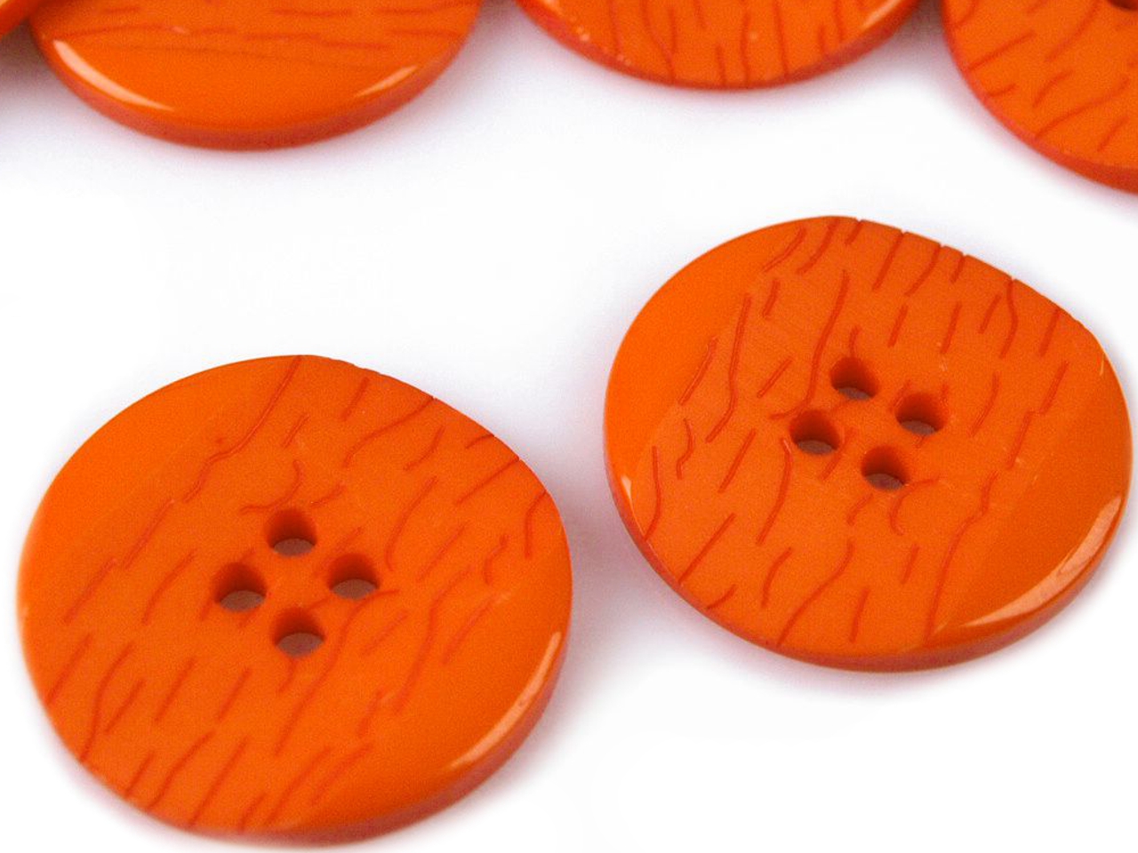 Nööp plastik 4 auguga 25,2 mm, erin.värvid